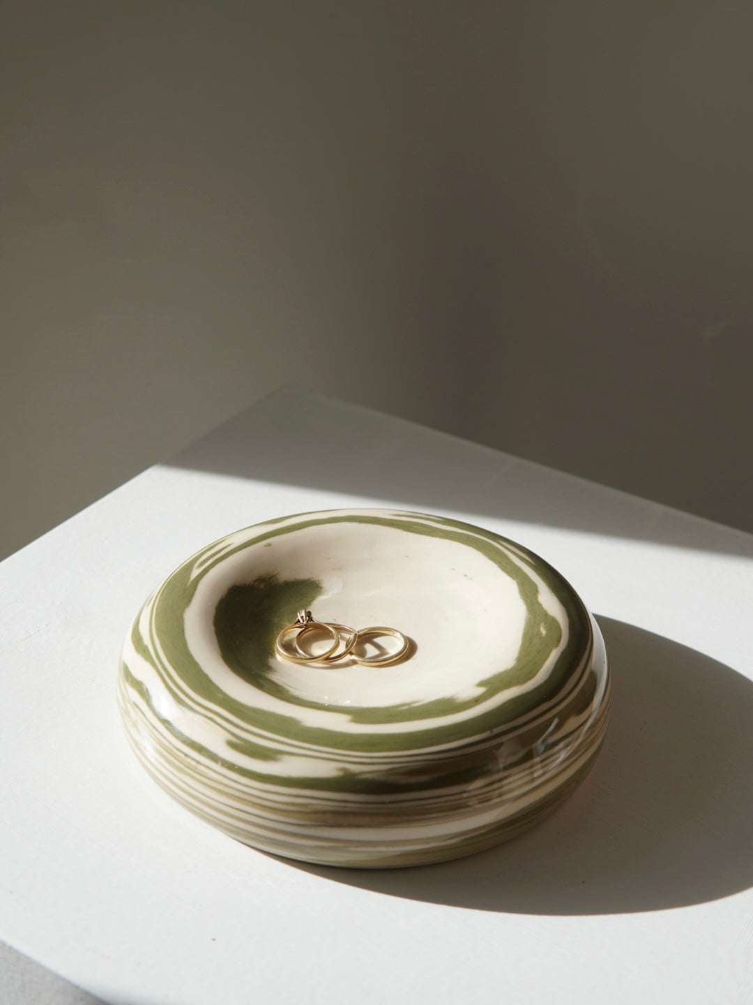 Earthenware decorative wall object / bowl green swirl