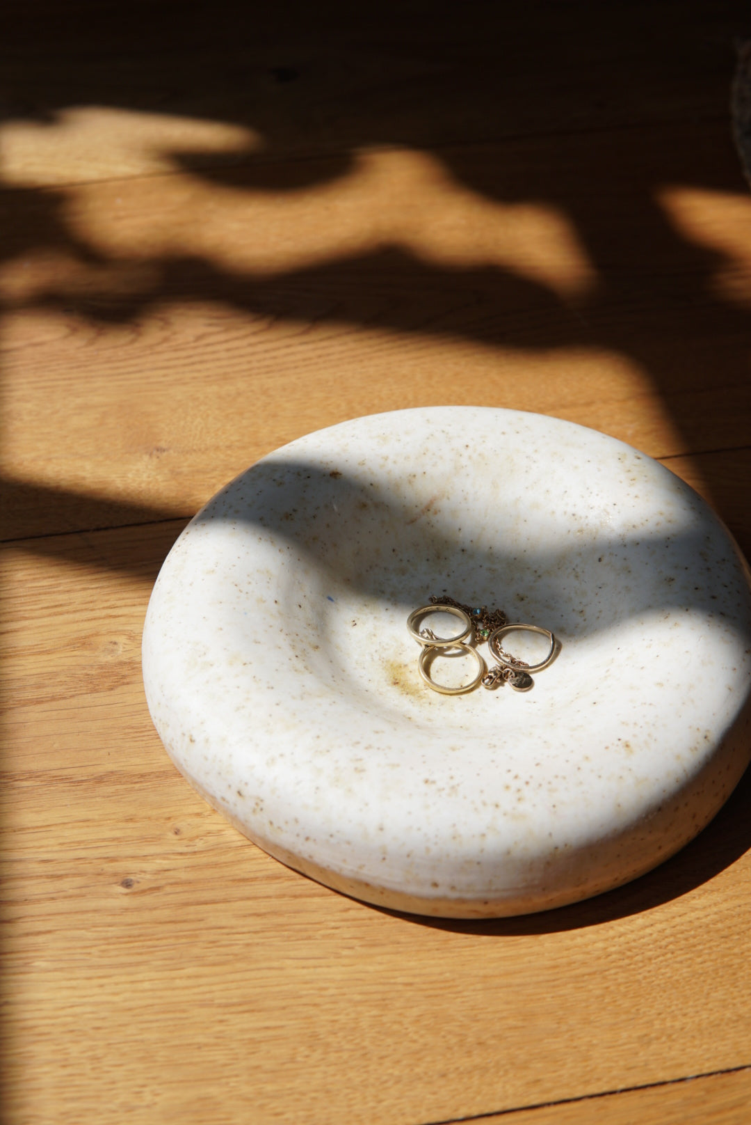 Earthenware decorative wall object / bowl white speckled